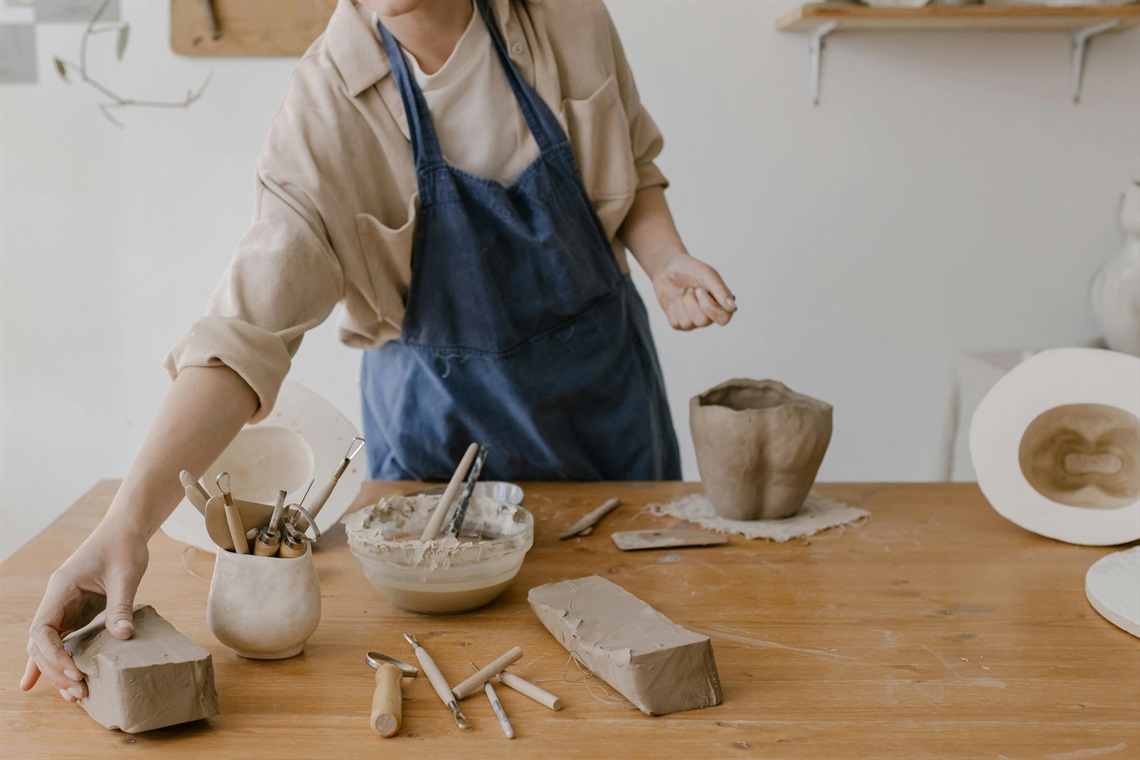 Clay NAIDOC week workshop at MAC yapang image shows person using air dry clay to create art 